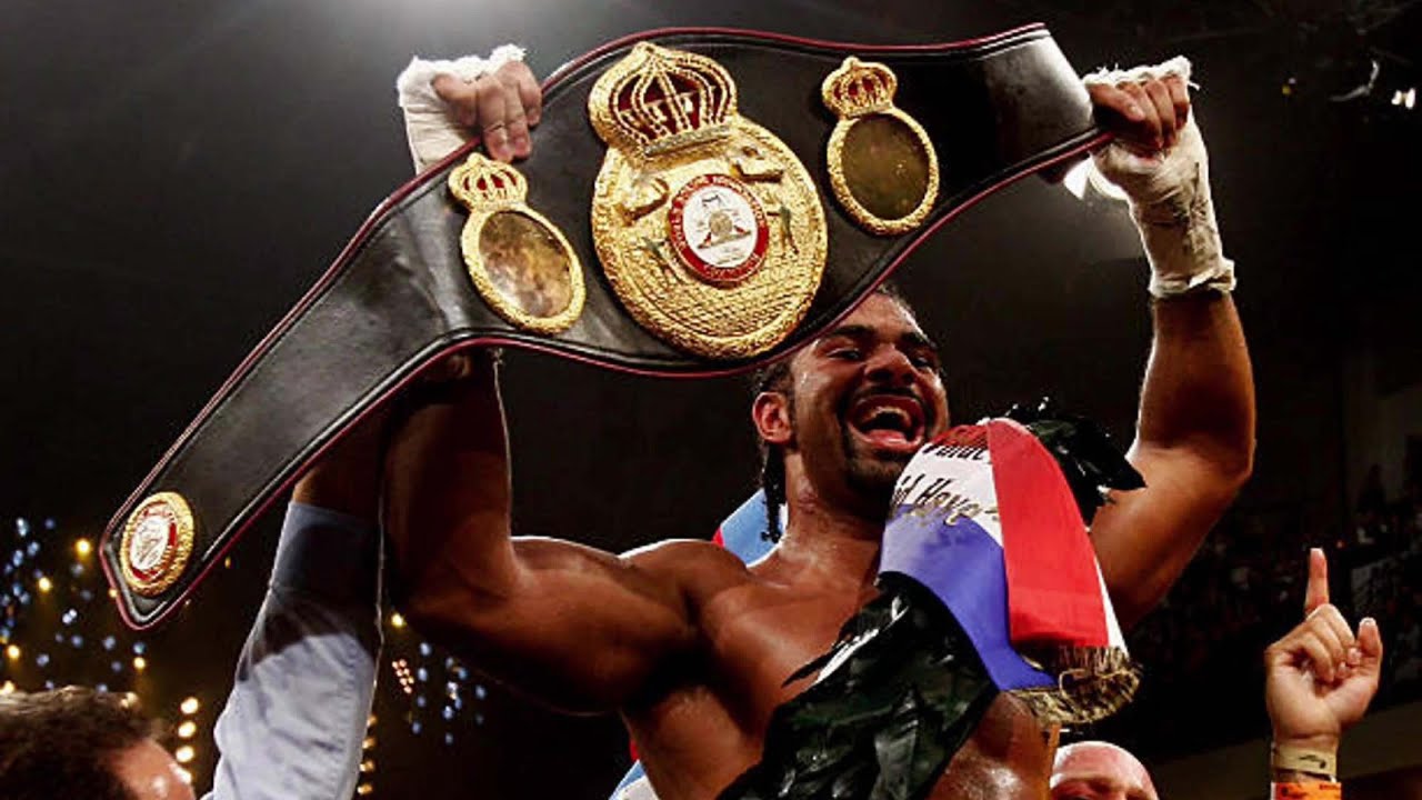 David Haye lifting his world title belts after a fight.